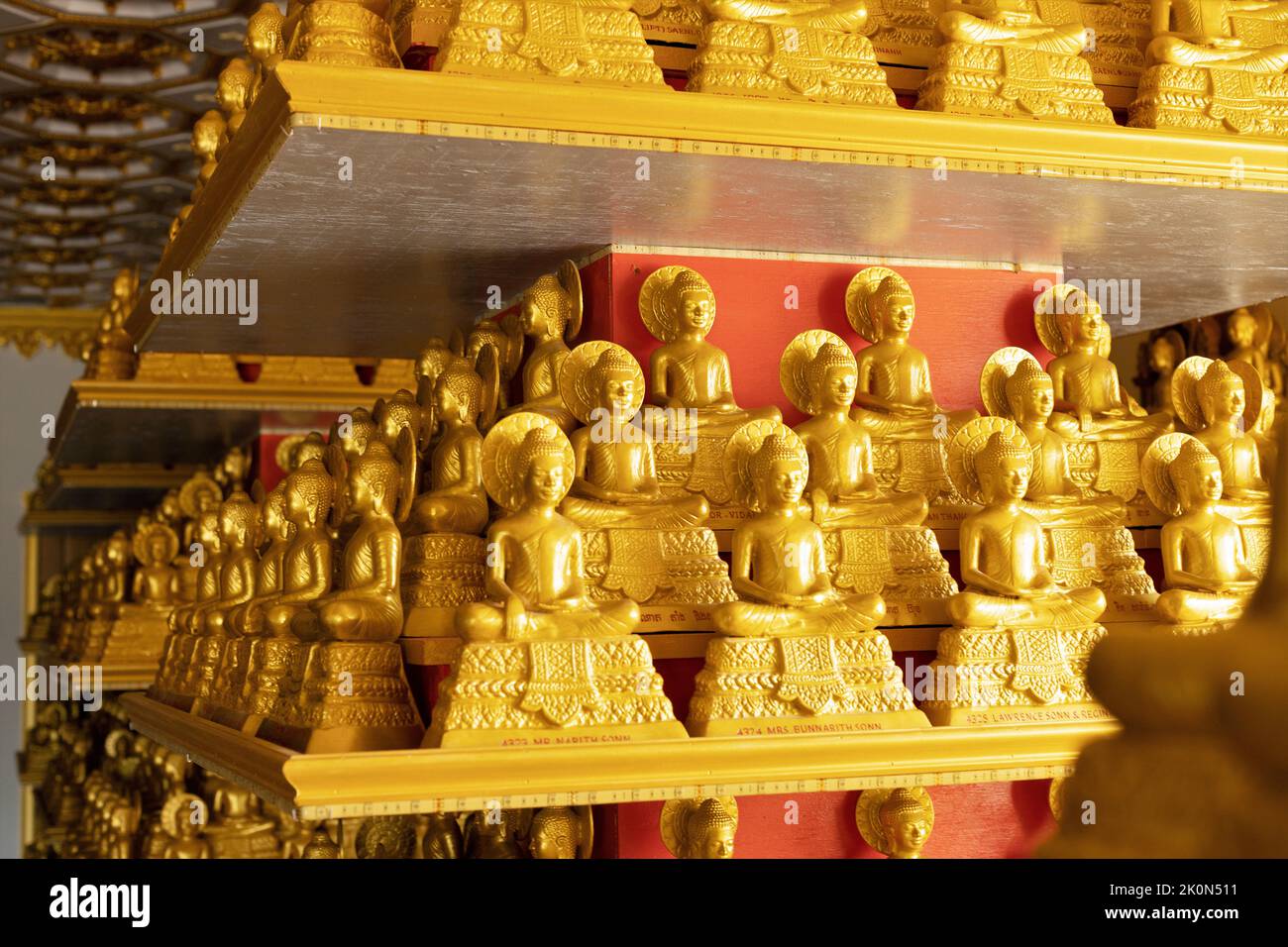 Gold Buddha statues at Watt Munisotaram Cambodian Buddhist Monastery in Hampton, Minnesota. Stock Photo