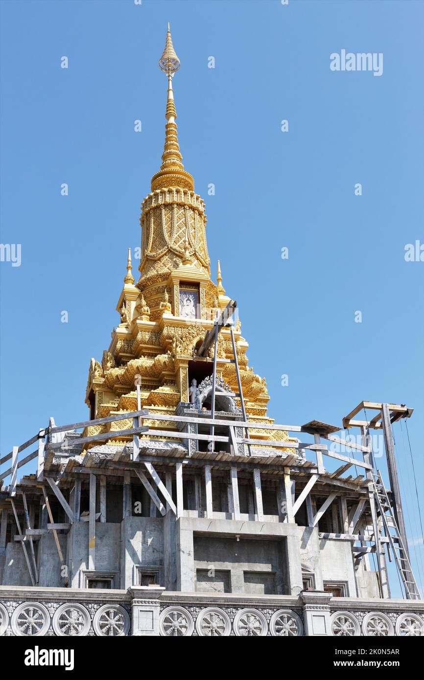 A partially finished temple with gold spire under construction at Watt Munisotaram Cambodian Buddhist Monastery in Hampton, Minnesota. Stock Photo