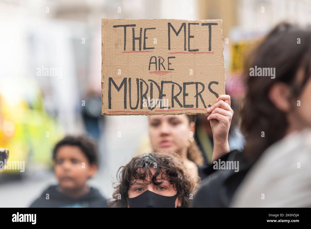 Black Lives Matter protest taking place in Whitehall prompted by the police shooting of Chris Kaba, an unarmed victim. The Met are murderers placard Stock Photo