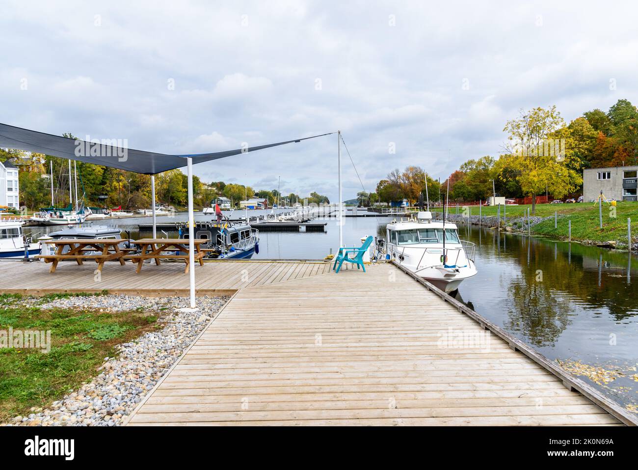 View of a deserted marina on a lake on a cloudy autumn day. Picton, On, Canada. Stock Photo