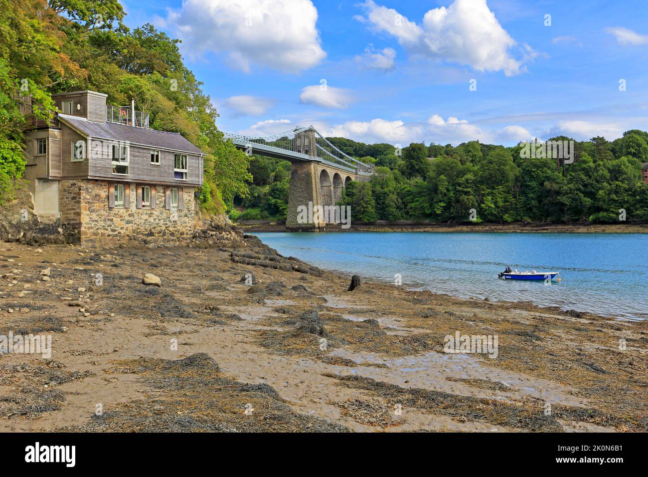 Thomas Telford’s Menai Suspension bridge, Pont Menai, from the Menai Strait, Menai Bridge, Isle of Anglesey, Ynys Mon, North Wales, UK. Stock Photo