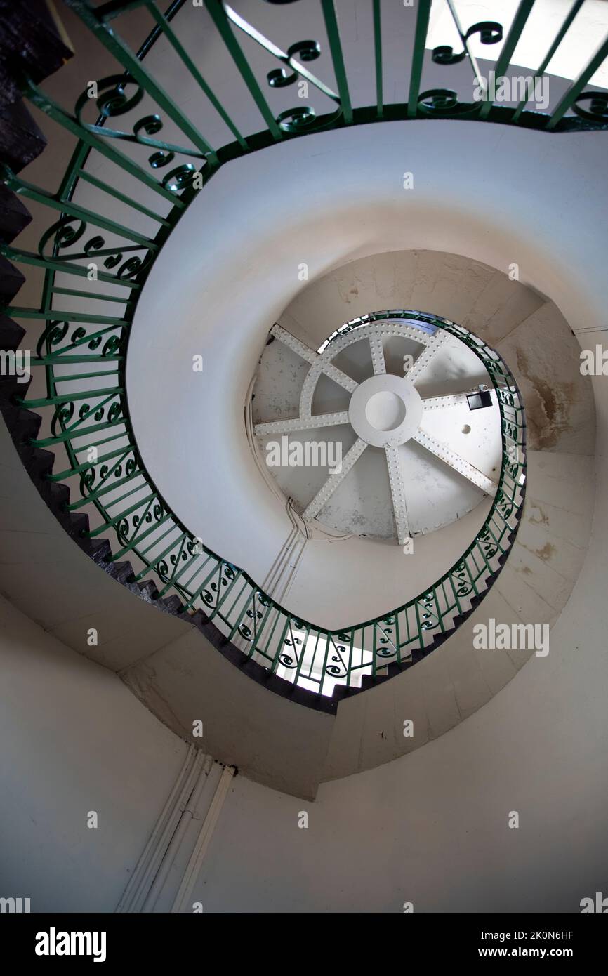 The spiral staircase inside old Dungeness lighthouse, Kent, England Stock Photo