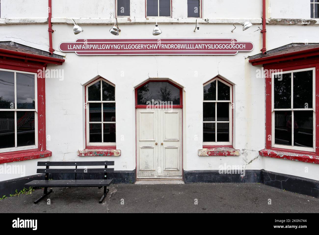 Front of the disused Llanfairpwll railway station building including the famous sign, Llanfairpwll, Isle of Anglesey, Ynys Mon, North Wales, UK. Stock Photo