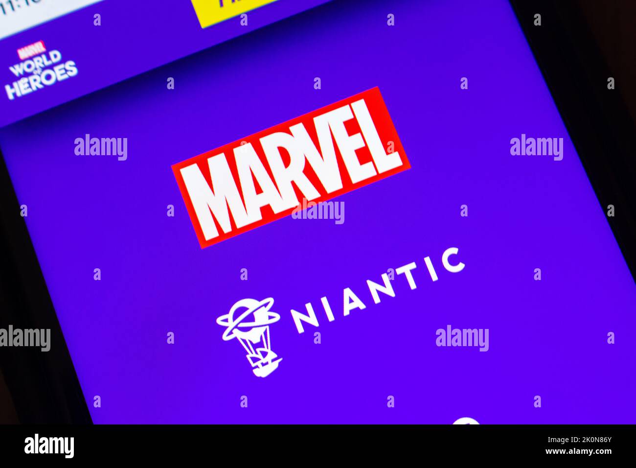 MARVEL and Niantic logos on MARVEL World of Heroes website on iPhone. MARVEL and Niantic teamed up to launch AR Mobile Game MARVEL World of Heroes Stock Photo