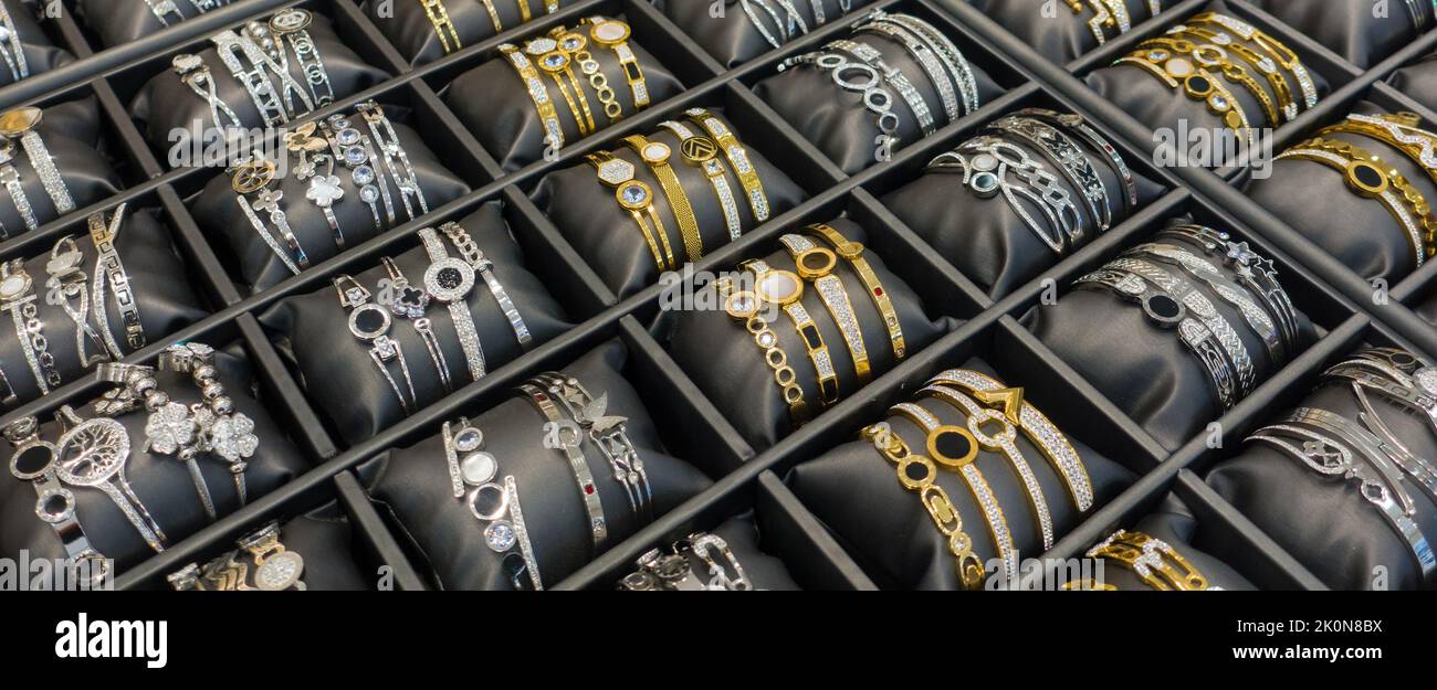 Photo of gold and silver jewelry in a jewelry shop Stock Photo