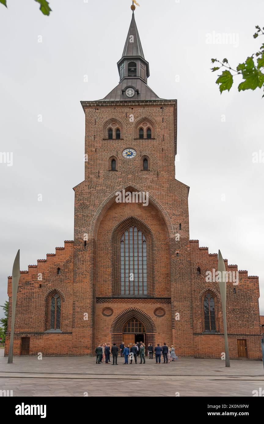 wedding people standing in front of st. canute's cathedral in Odense, Denmark, August 27, 2022 Stock Photo