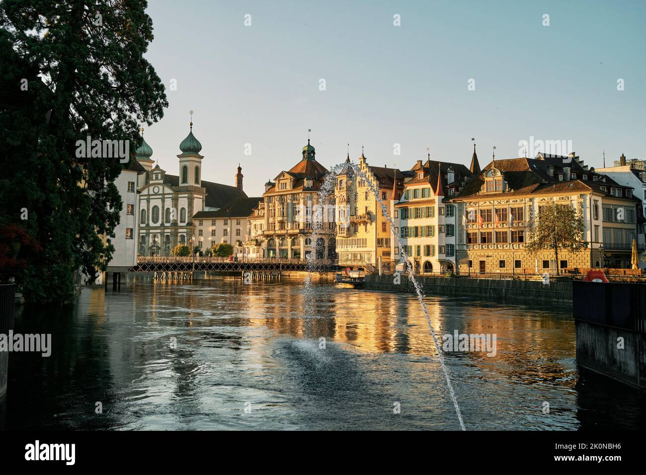 Water jet flowing into river at sunset in Lucerne Stock Photo - Alamy