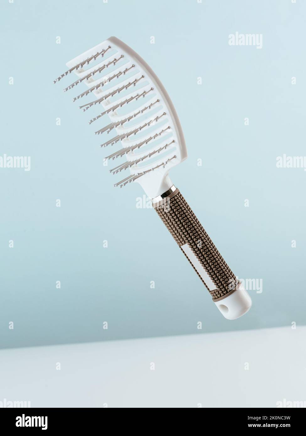 combs for hair on a blue background Stock Photo
