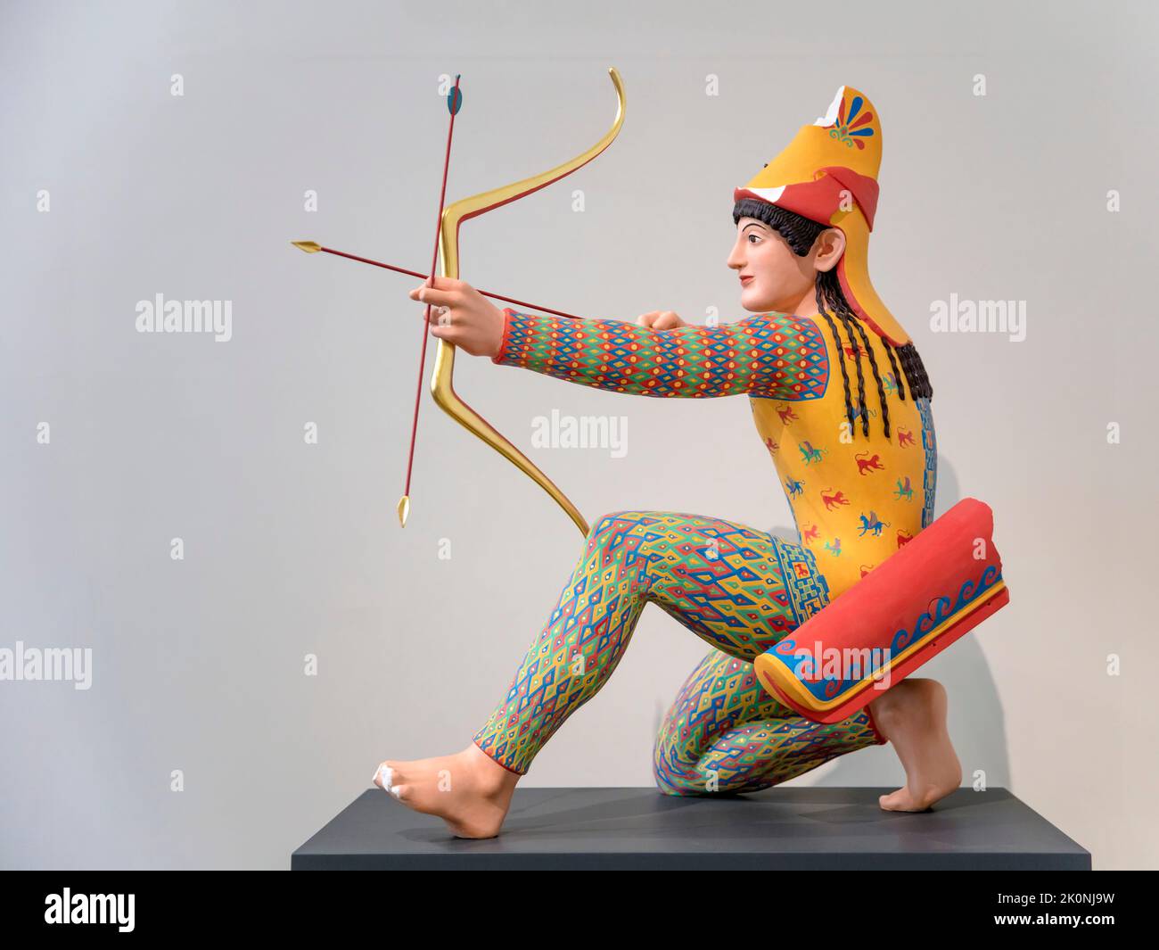 Reconstruction with original colours of a marble archer in costume of a horseman of neighbouring peoples to the north and east of Greece Stock Photo