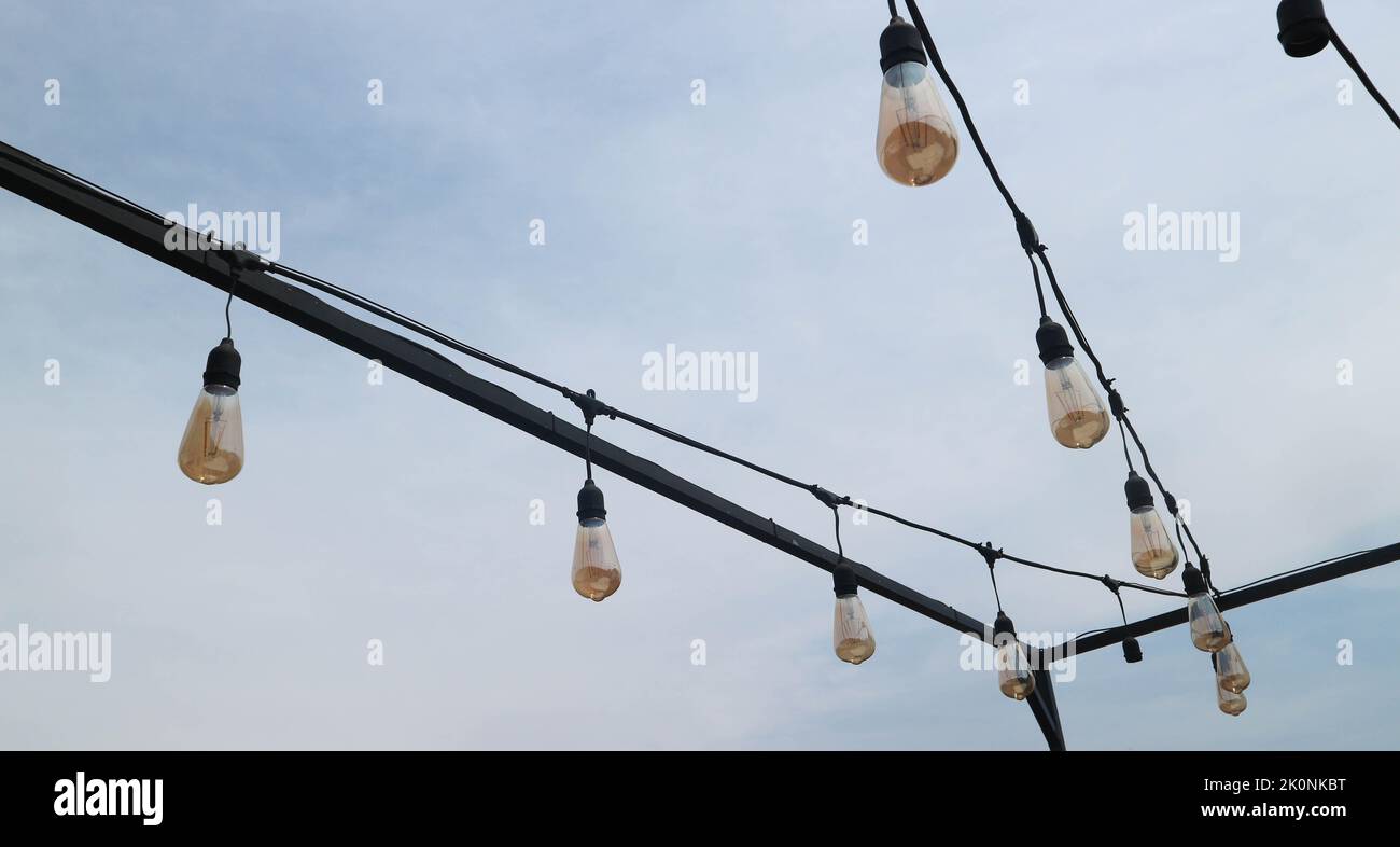 The string light bulbs hang under the clear sky Stock Photo Alamy
