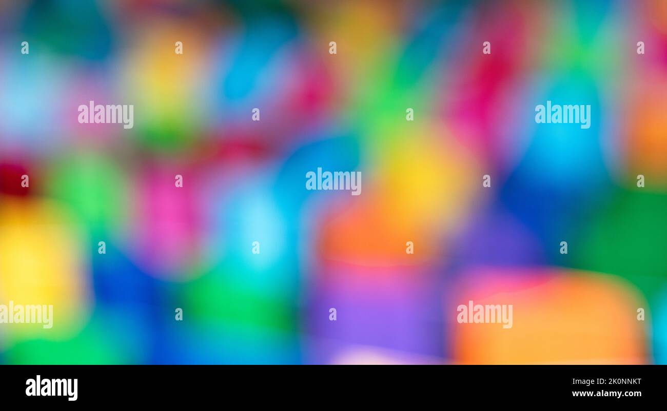 A close-up of an out-of-focus abstract background with bright mixed colors. Abstract graphics source Stock Photo