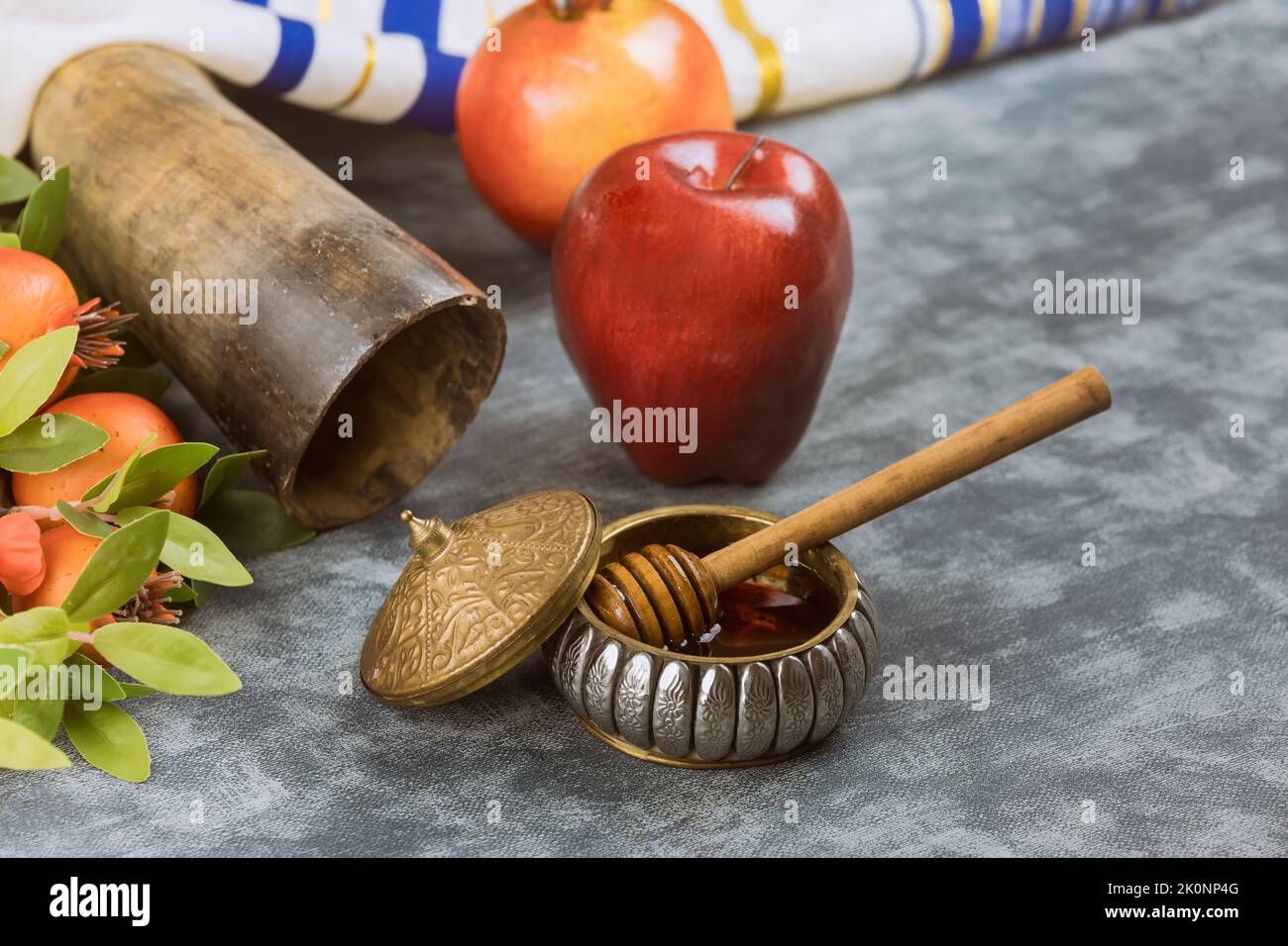 There are a number of traditional Jewish New Year symbols associated with Rosh Hashanah, such as apples, honey, and pomegranates Stock Photo