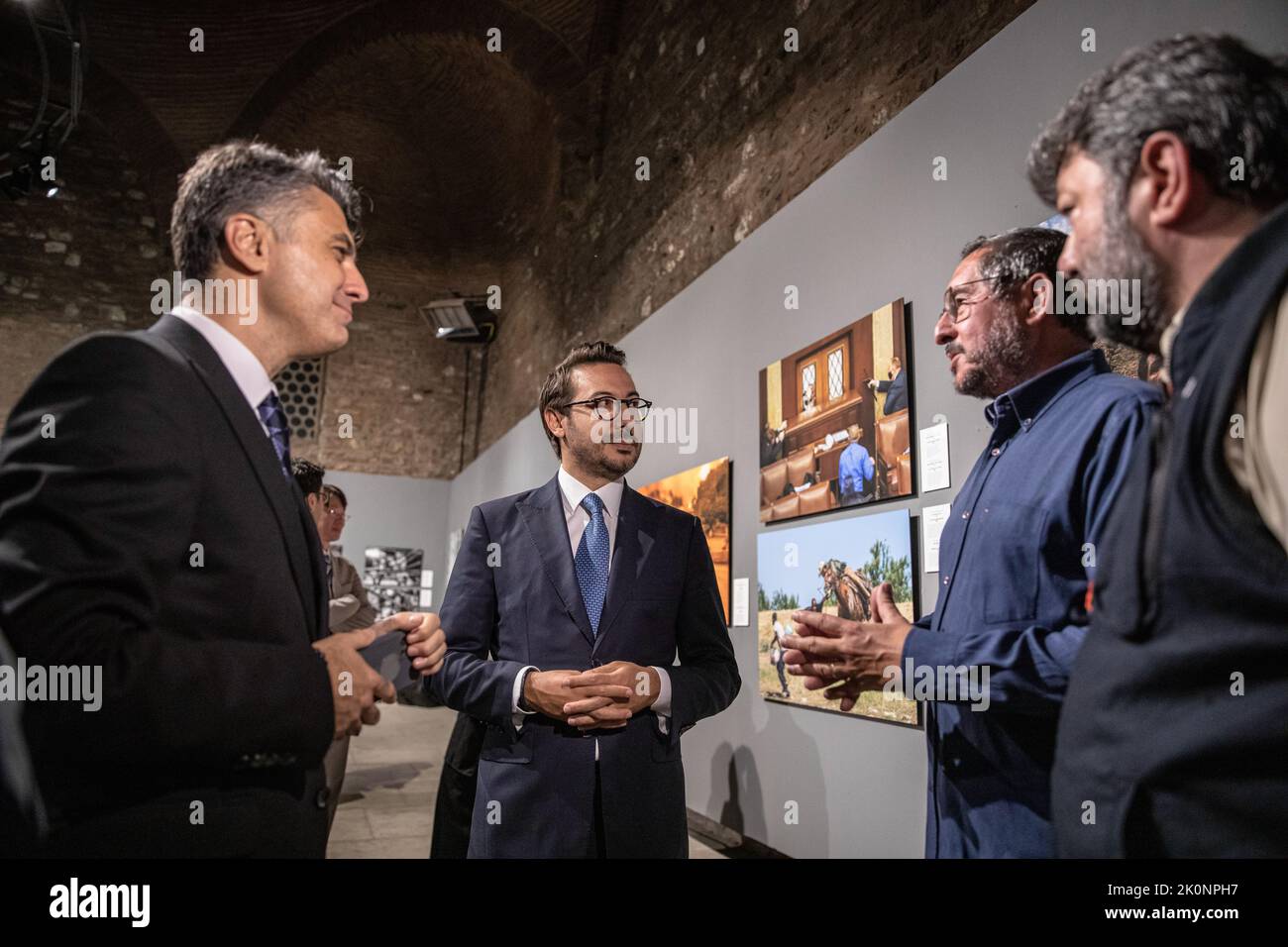 Istanbul, Turkey, 12/09/2022, Anadolu Agency General Manager Serdar Karagoz (left2) and Anadolu Agency Visual News Editor Firat Yurdakul (left1) seen talking to the guests about the exhibition. Istanbul Photo Awards 2022 Exhibition At Mimar Sinan Fine Arts University Tophane-i Amire Culture and Art Center, at the Single Dome building, with the participation of Anadolu Agency General Manager Serdar Karagoz, after the opening speech, Mimar Sinan Fine Arts University Rector Prof. Dr. Handan ?nci Elci opened with the presence of Beyoglu Mayor Haydar Ali Yildiz and guests. Award-winning photographs Stock Photo