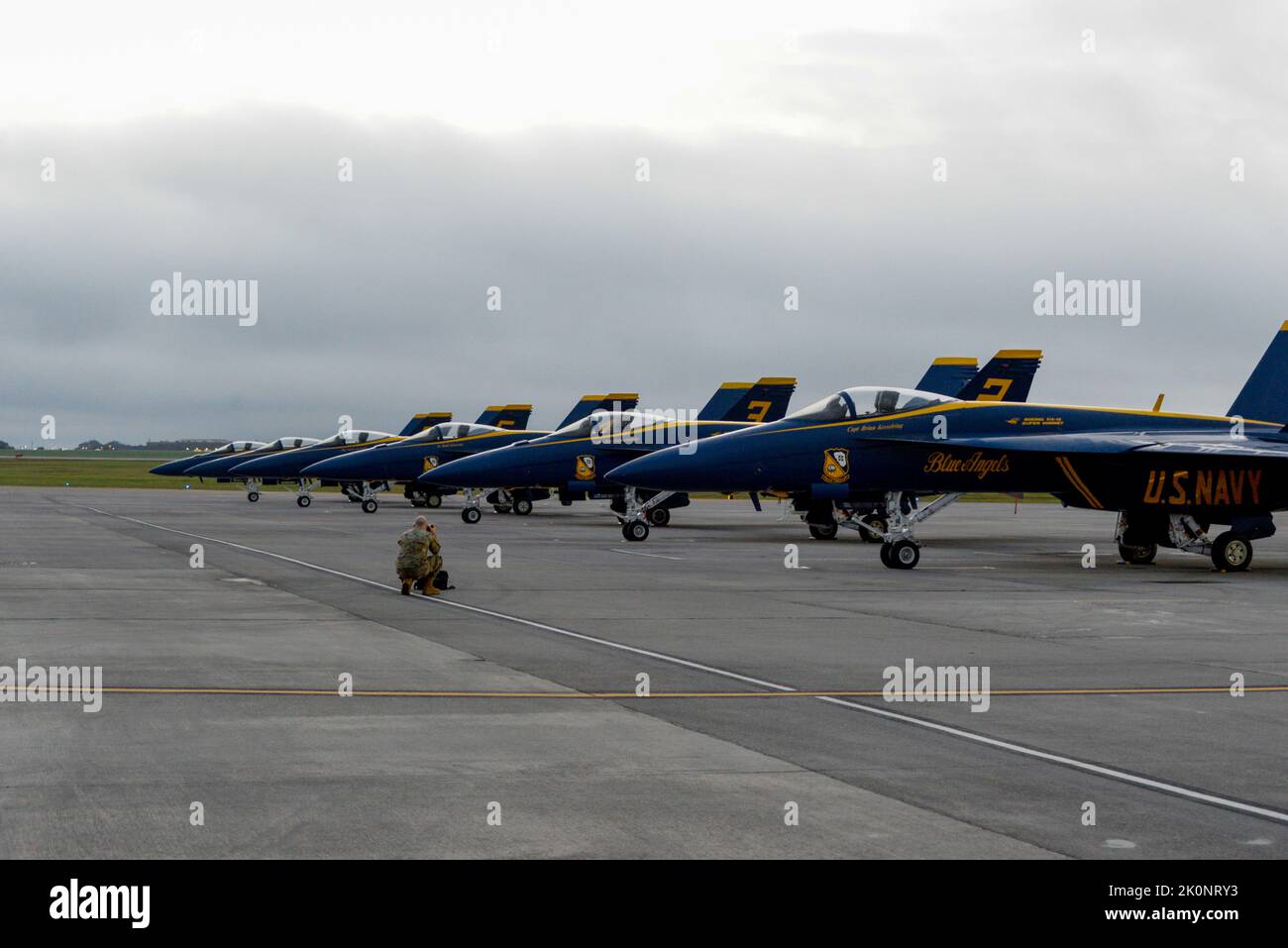 An Air National Guard photographer takes a photo of a row of Blue