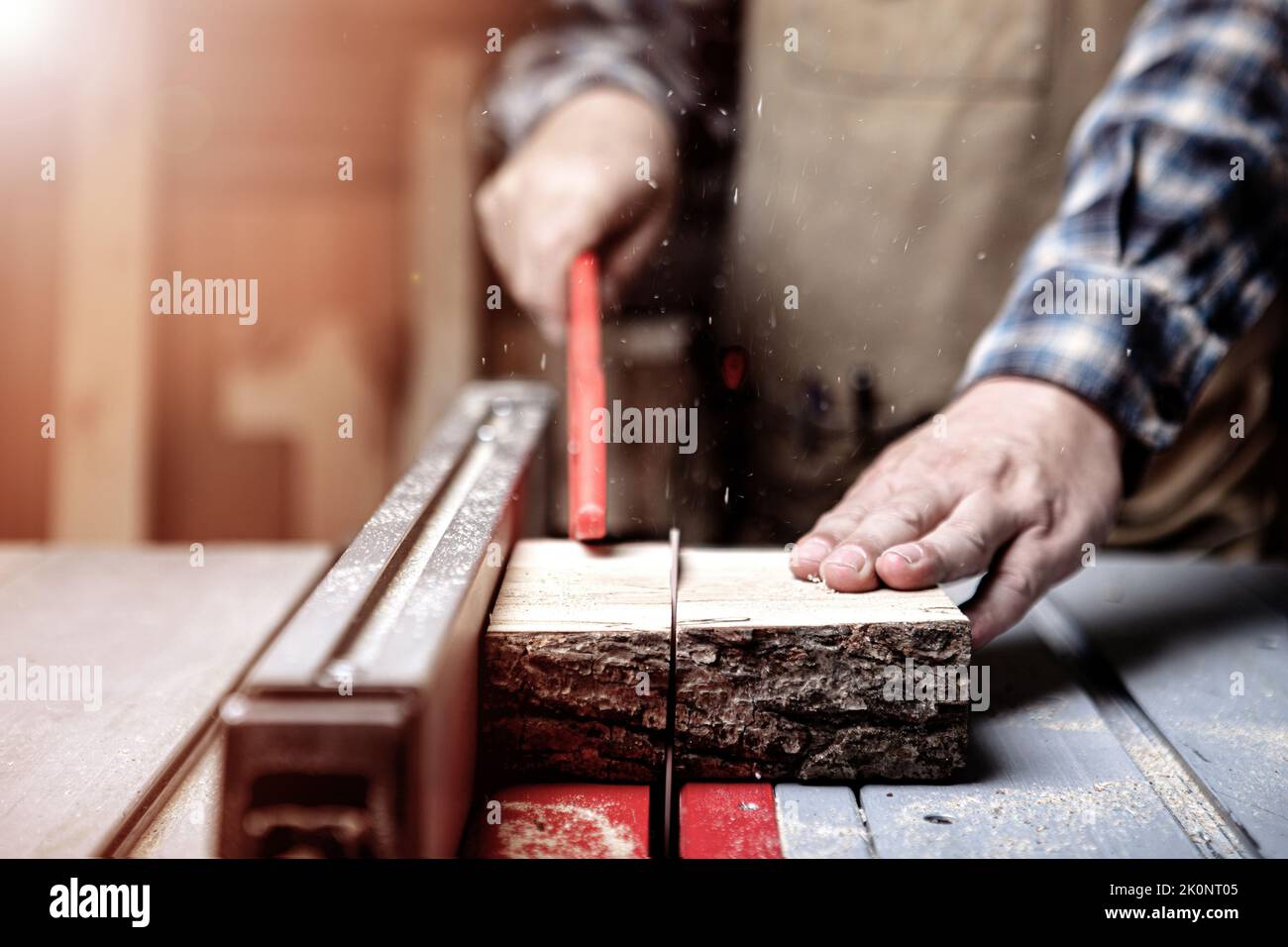 Cutting wood with table saw in carpenter's Stock Photo Alamy