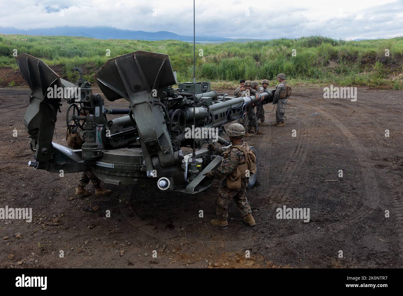 U.S. Marines with Charlie Company, 3d Battalion, 12th Marines, 3d Marine Division inplace an M777 howitzer during Artillery Relocation Training Program 22.2 at the Combined Arms Training Center, Camp Fuji, Japan, Aug. 29, 2022. ARTP is an exercise held to strengthen the defense of Japan and the U.S.-Japan Alliance as the cornerstone of peace and security in the Indo-Pacific region. (U.S. Marine Corps photo by Lance Cpl. Jaylen Davis) Stock Photo