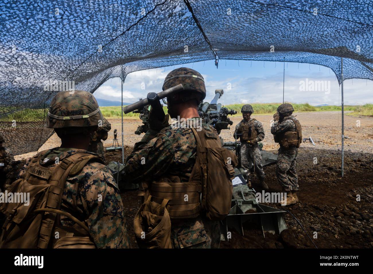 U.S. Marines with Charlie Company, 3d Battalion, 12th Marines, 3d Marine Division prepare to load a 155mm round into an M777 howitzer during Artillery Relocation Training Program 22.2 at the Combined Arms Training Center, Camp Fuji, Japan, Aug. 29, 2022. ARTP is an exercise held to strengthen the defense of Japan and the U.S.-Japan Alliance as the cornerstone of peace and security in the Indo-Pacific region. (U.S. Marine Corps photo by Lance Cpl. Jaylen Davis) Stock Photo