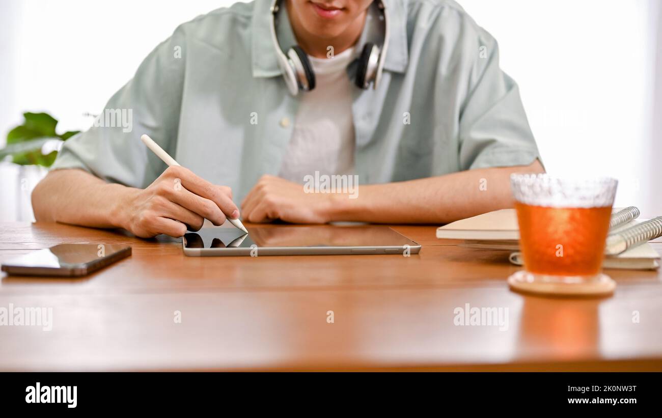 Young man drawing on touchpad hi-res stock photography and images - Alamy