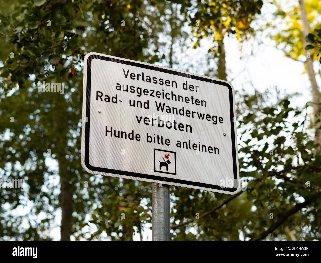 German sign that says that it is forbidden to go out of the paths and