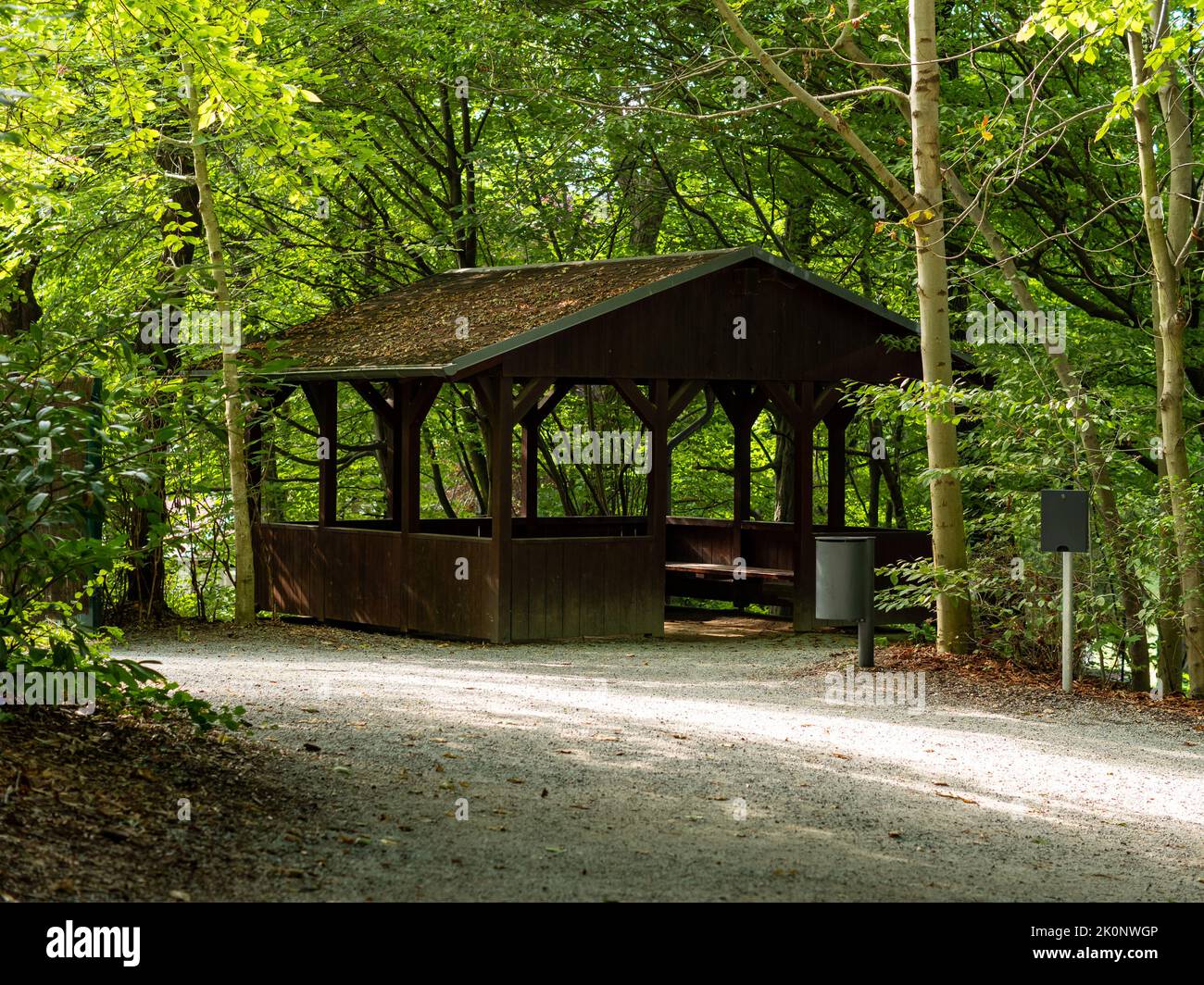 Wooden cabin for tourists in the woodlands. Travelling in a forest and finding a public place to rest. Empty house in the nature to enjoy leisure time Stock Photo