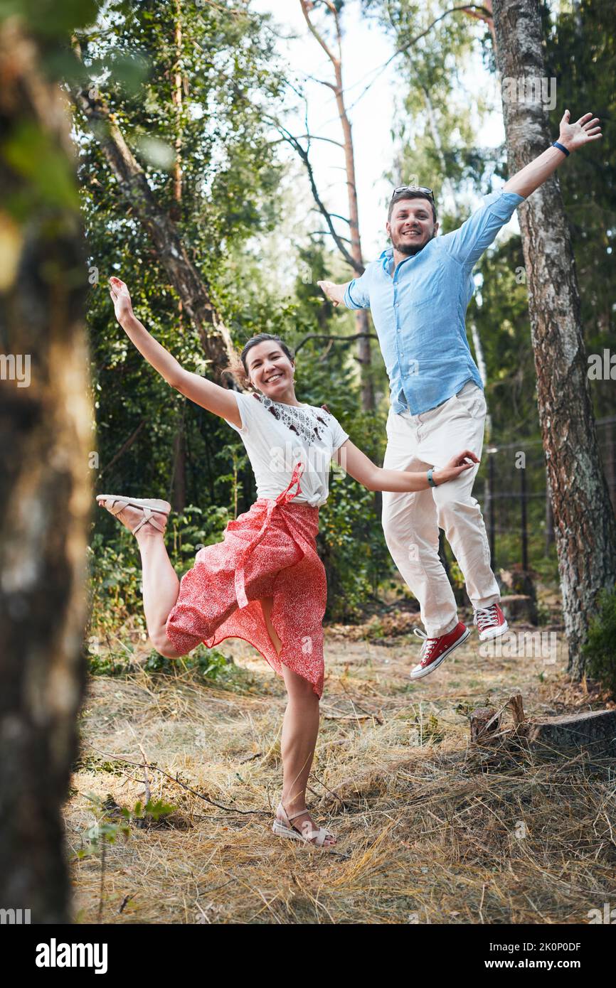 Portrait of a young couple in love on a date in the woods. Vertical photo. Stock Photo