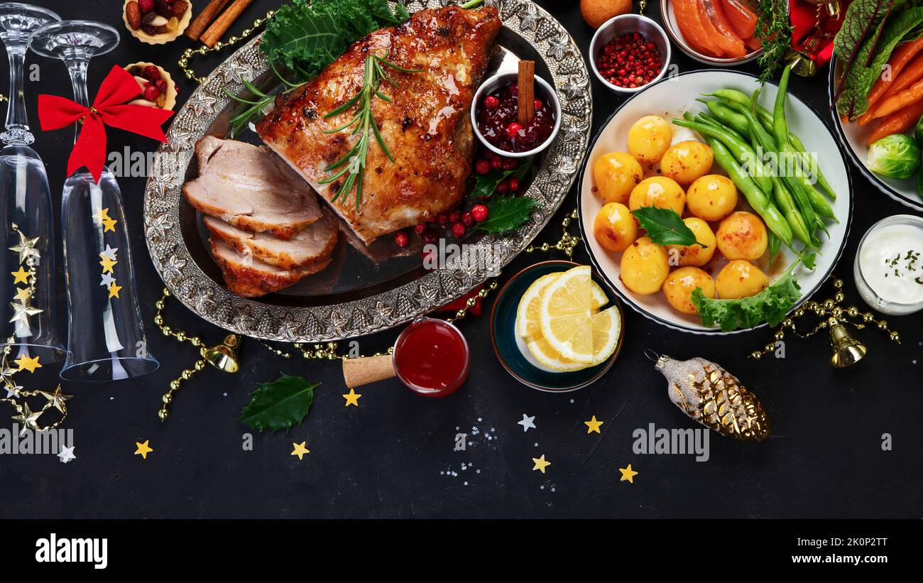 Traditional Christmas dinner on dark background. Holiday food. Top view, copy space Stock Photo