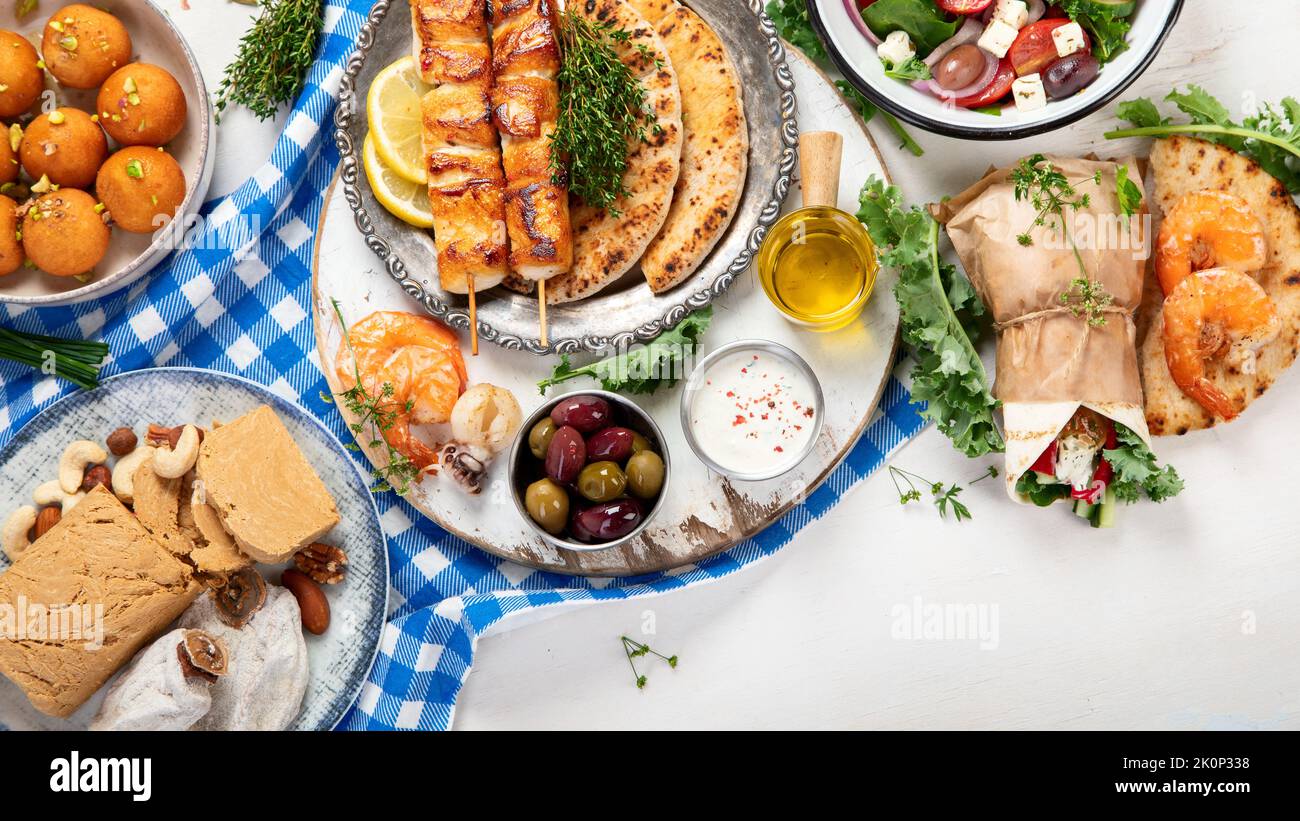 Greek cuisine dishes on neutral background. Traditional food concept. Top view, copy space Stock Photo