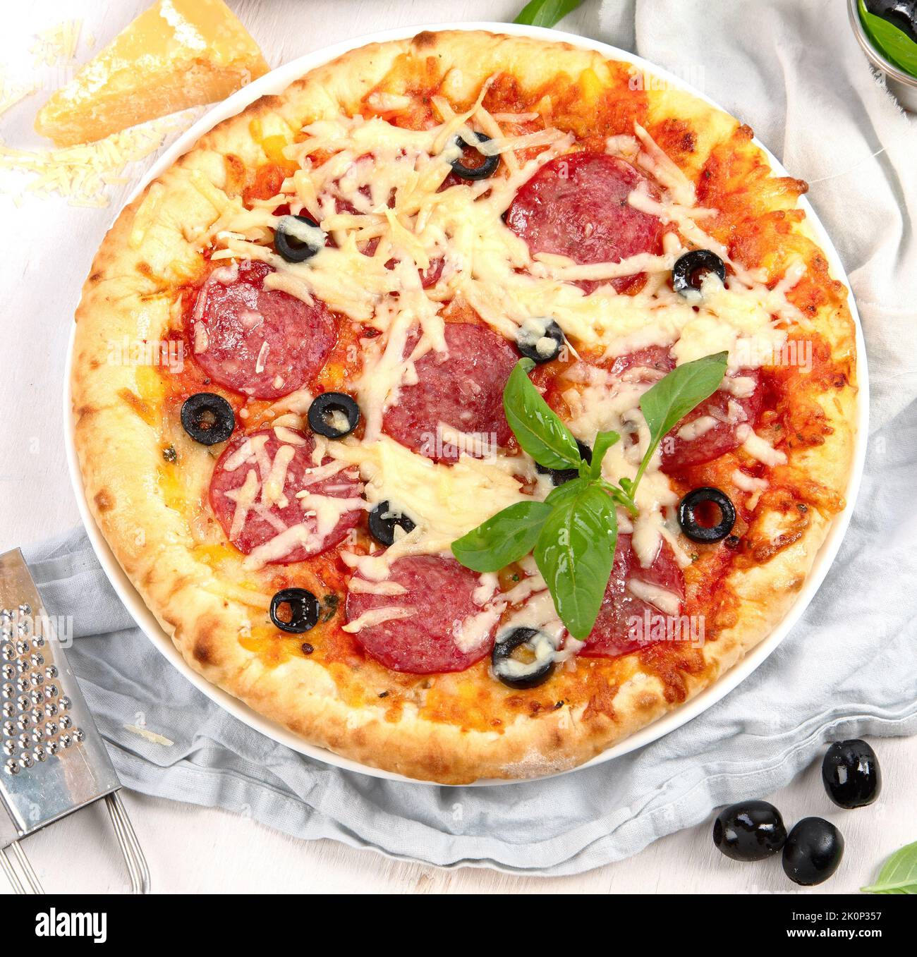 Freshly baked pizza on dark background. Tasty homemade food concept. Top view, copy space Stock Photo