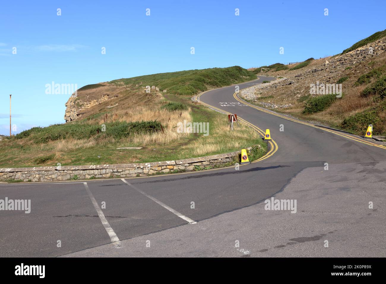 The exit road from Southerndown bay or Dunraven bay as it is also known, showing the steep hill climb that everyone has to do to go home. Stock Photo