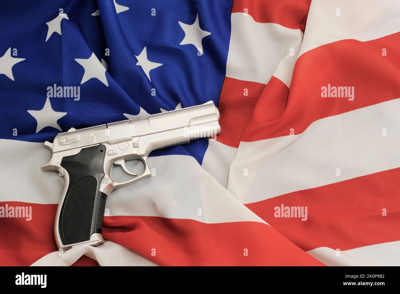 flag of US and gun, problem of gun control in the United States Stock Photo