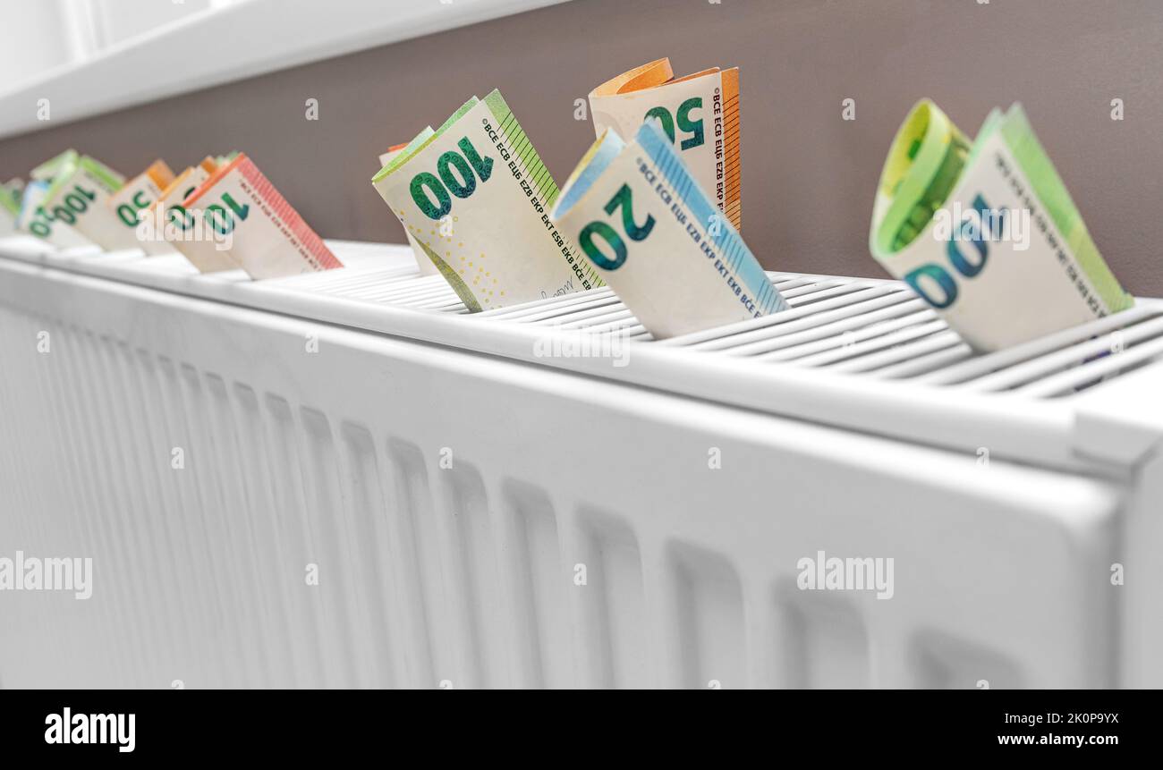 Euro money on the radiator. Stock Photo