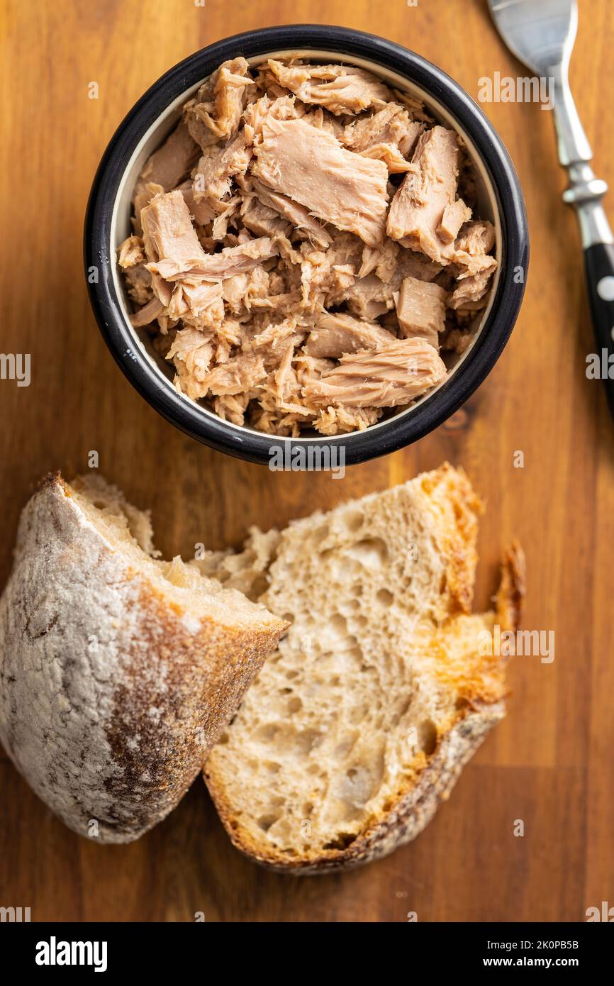 Canned tuna fish in the bowl. Top view Stock Photo Alamy