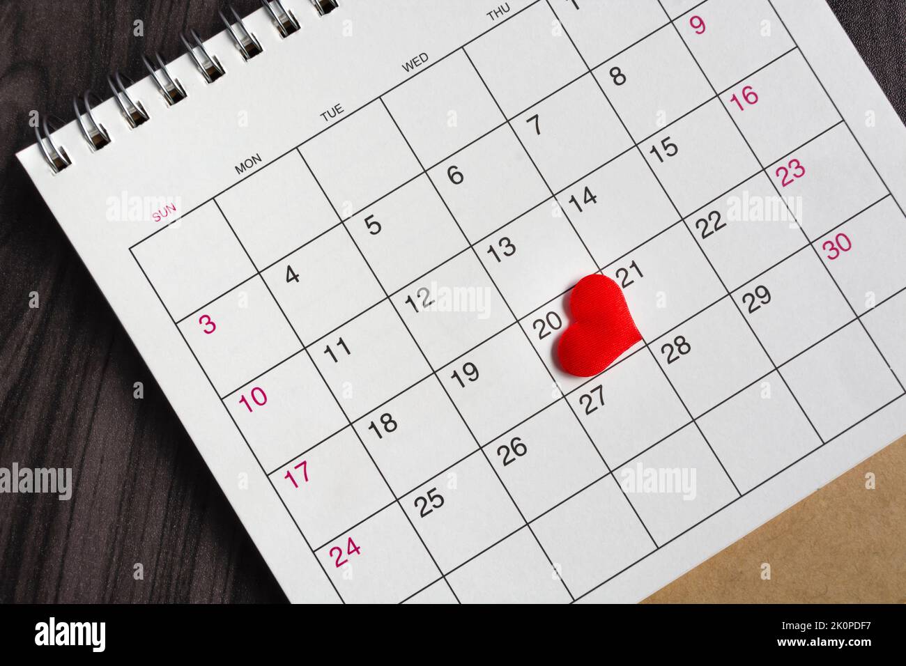 Red heart shape on the date of the 20th day in the calendar. Stock Photo