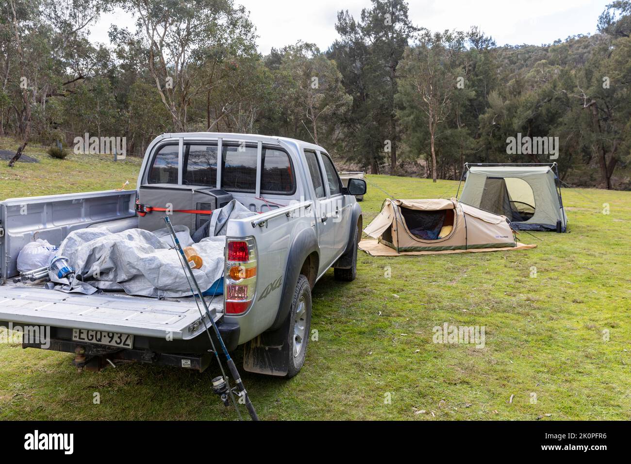 Australian campsite in Abercrombie river national park in regional New South Wales, swag tent and Mazda Ute vehicle,Australia Stock Photo