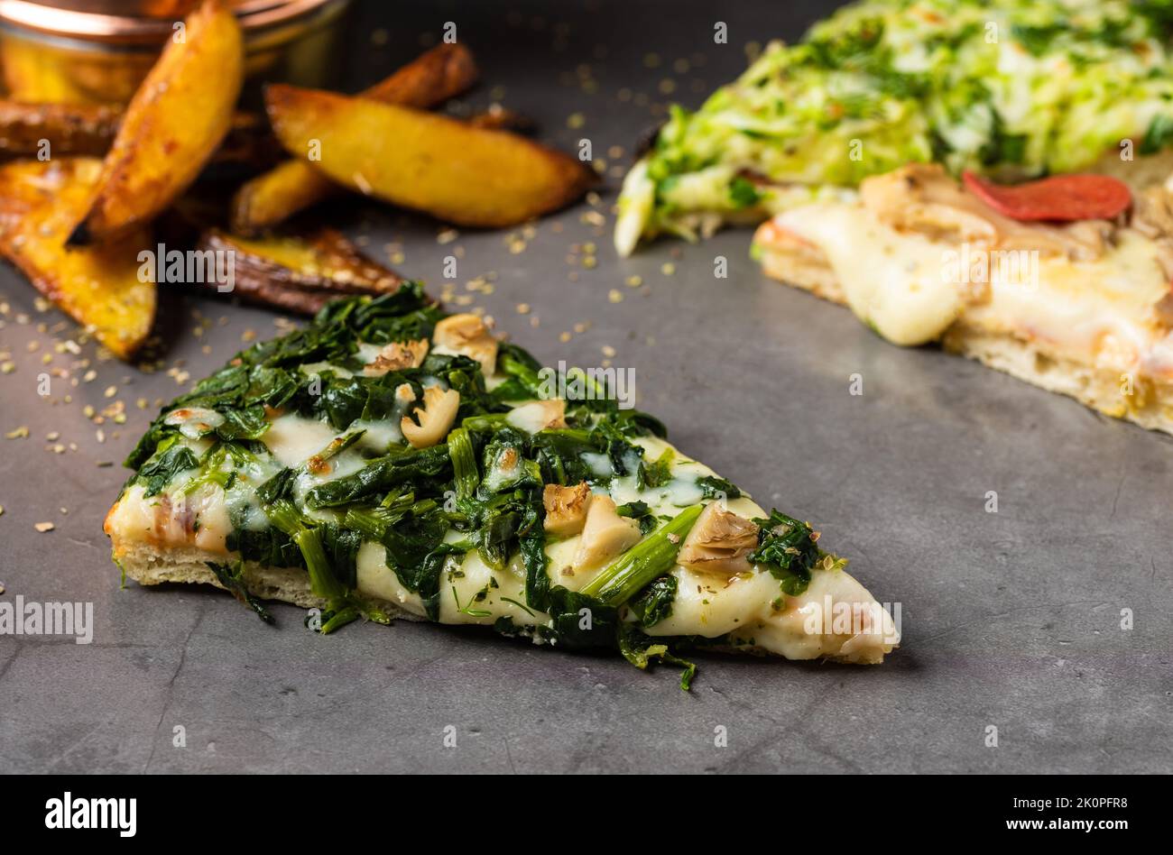 Assorted handmade Argentinian pizza on stone background Stock Photo