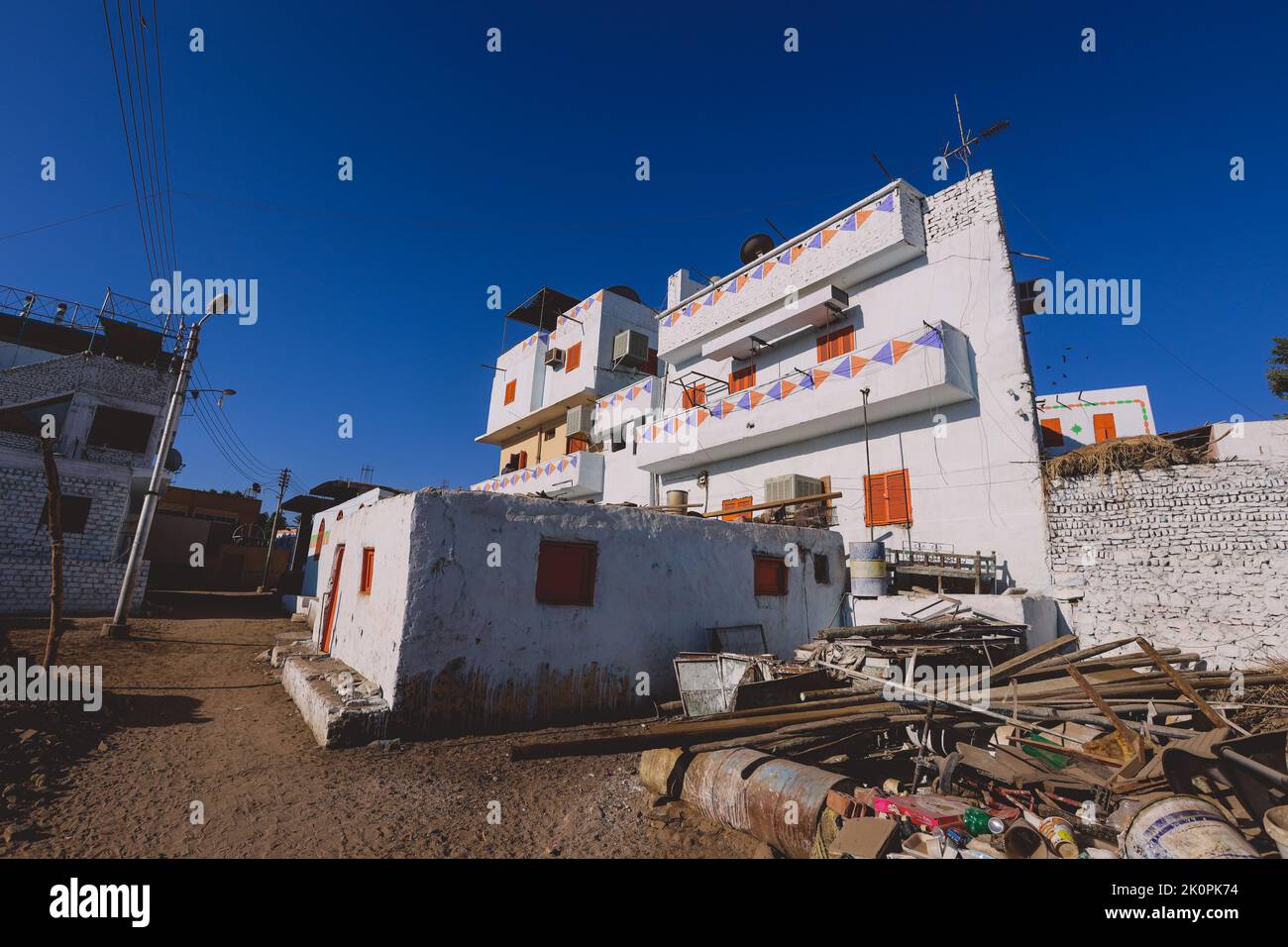 Colorful Buildings in Aswan with Local Nubian Style Decoration on the Walls, Egypt Stock Photo