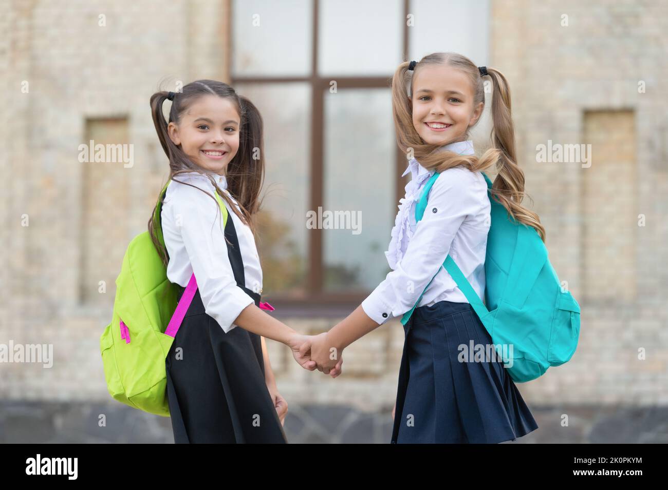 positive two school girls best friends together outdoor Stock Photo Alamy