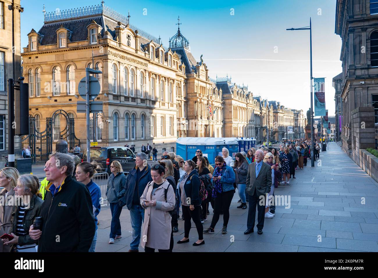 Edinburgh, Scotland, UK. 13th September 2022. Many members of the public queue to pay respects to Queen Elizabeth II who is resting inside St Giles Cathedral in Edinburgh  until returning to London this afternoon. Pic; Queue stretching along Chambers Street and into Bristo Square.   Iain Masterton/Alamy Live News Stock Photo