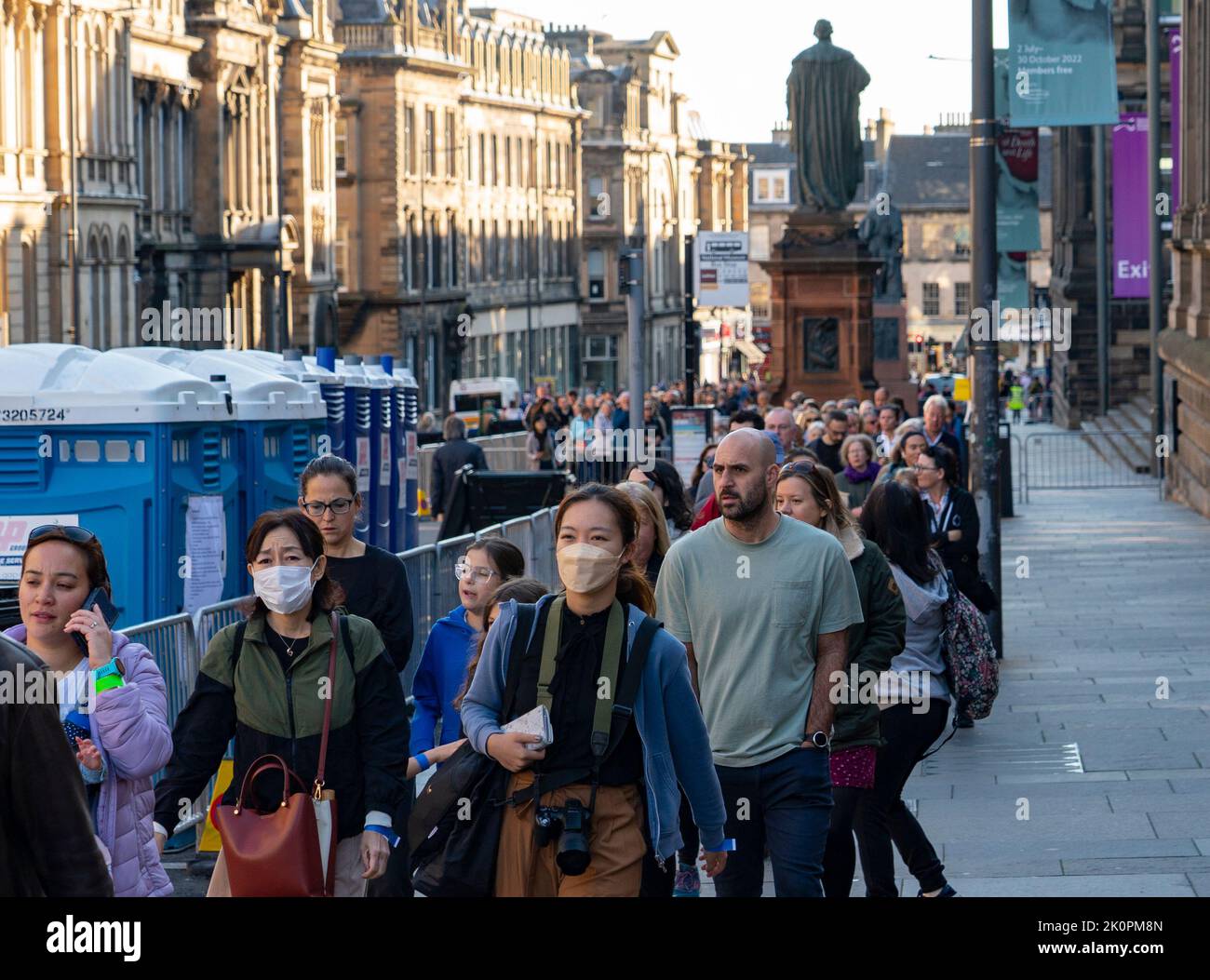 Edinburgh, Scotland, UK. 13th September 2022. Many members of the public queue to pay respects to Queen Elizabeth II who is resting inside St Giles Cathedral in Edinburgh  until returning to London this afternoon. Pic; Queue stretching along Chambers Street and into Bristo Square.   Iain Masterton/Alamy Live News Stock Photo