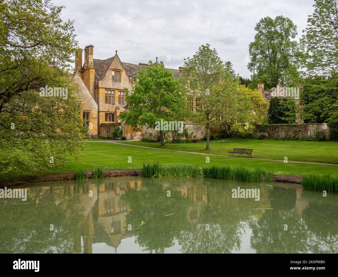 View across the duck pond to Stanway House, a Jacobean manor house from the 16th century, Stanway, Cotswolds, Gloucestershire Stock Photo