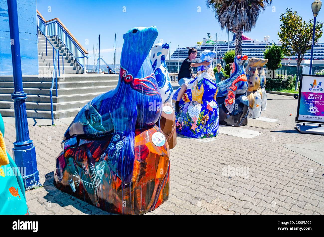 A row of colourful seal statues at Pier 39 outside the Aquarium in San Francisco, California, USA Stock Photo