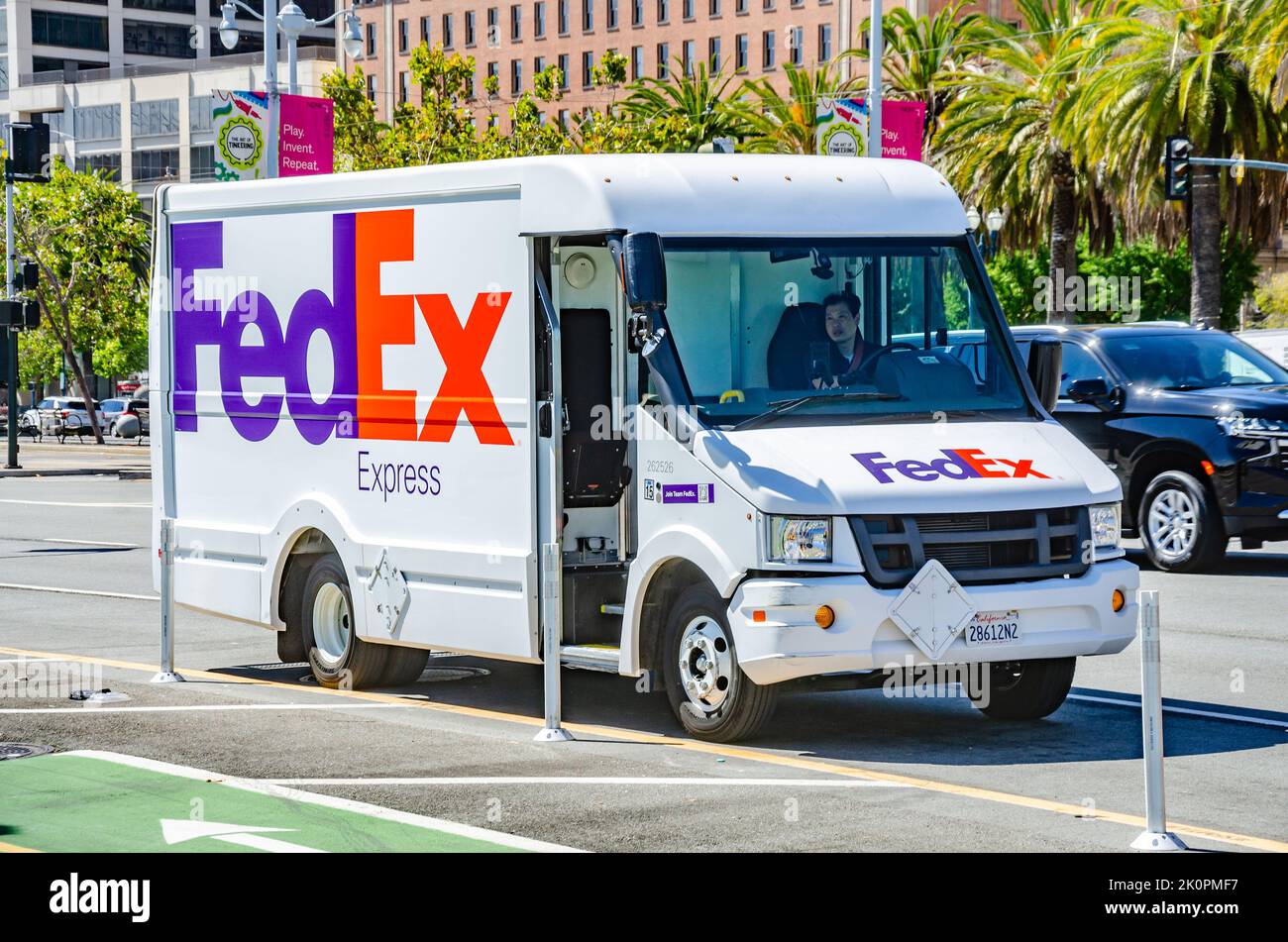 A white FedEx courier delivery van on The Embarcadero in San Francisco,, California. Stock Photo