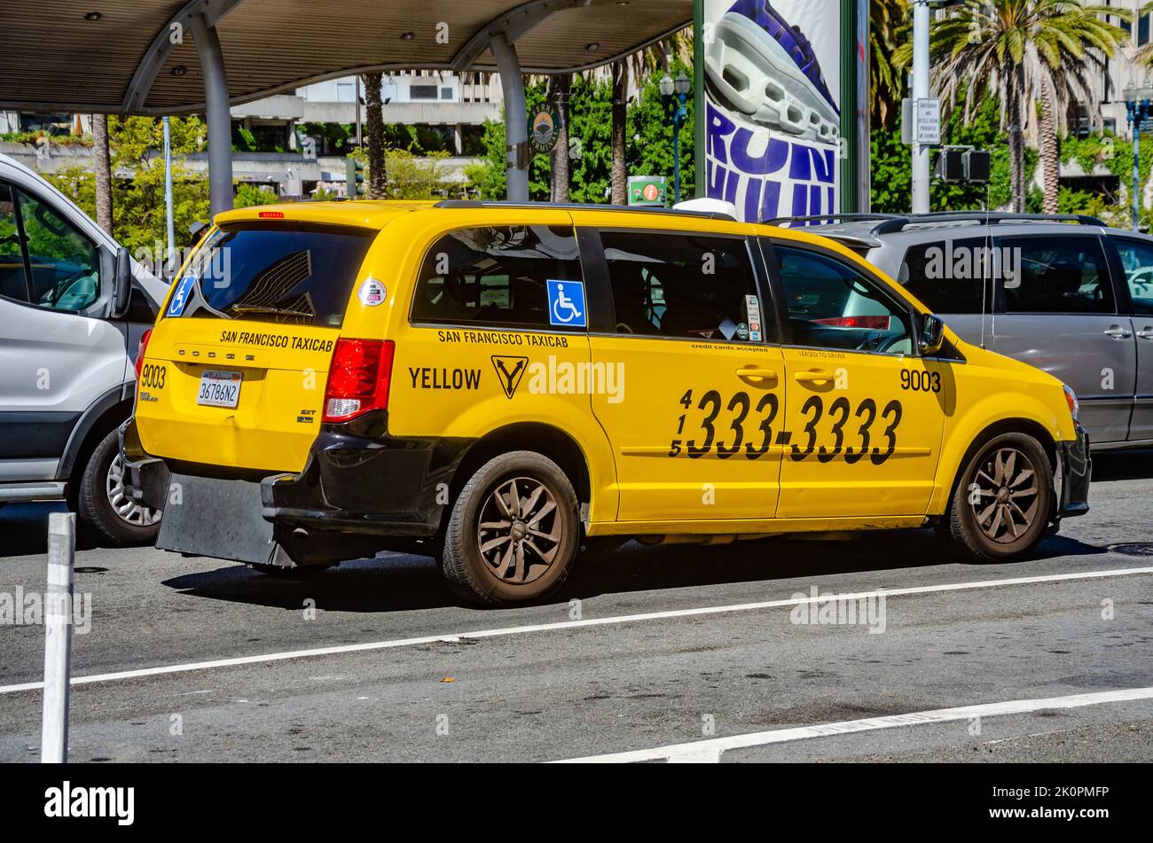 A yellow taxi cab stuck in traffic on Embarcadero in San Francisco, California, USA Stock Photo