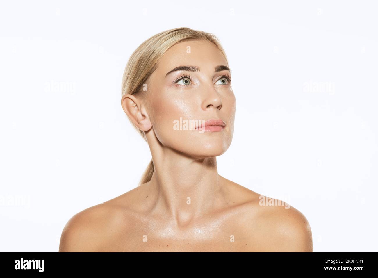 Young, beautiful 35 years old woman with wellkept skin isolated on white background. Spa, anti