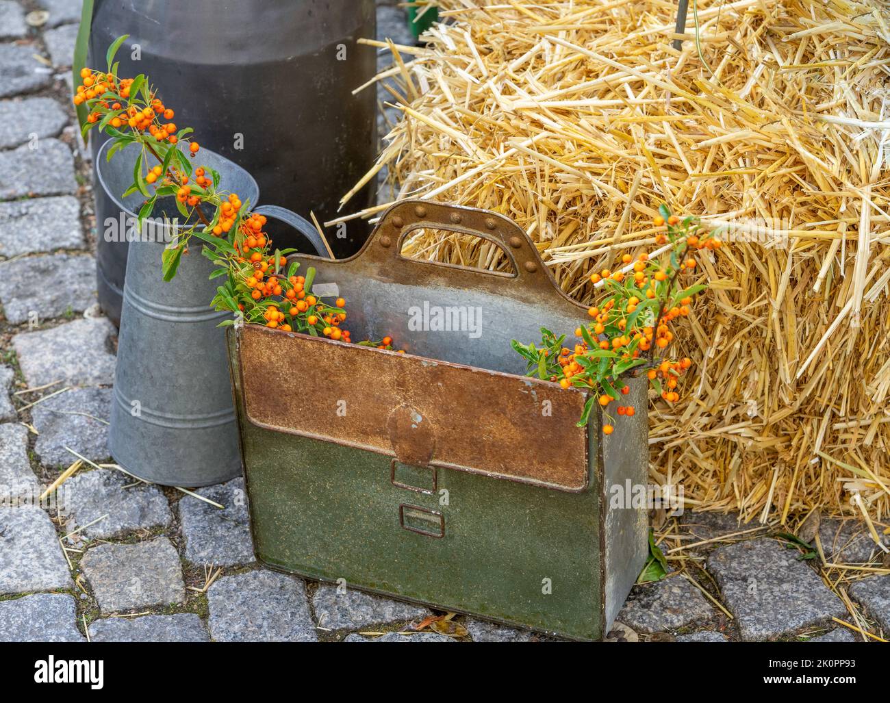 autumnal decoration with straw and milk cans Stock Photo