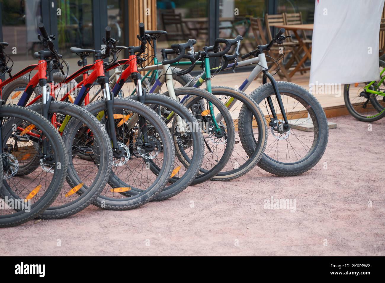 Bicycles stand by the building. Bicycles for rent. Active sporty people ...