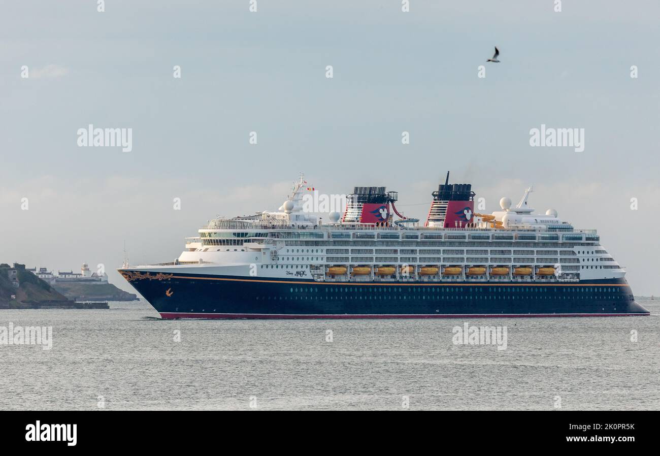 Cobh, Cork, Ireland. 13th September, 2022. After passing the Roches Point lighthouse Cruise ship Disney Magic steams up harbour on her way for a visit to the historic town of Cobh, Co. Cork, Ireland.  - Credit; David Creedon / Alamy Live News Stock Photo