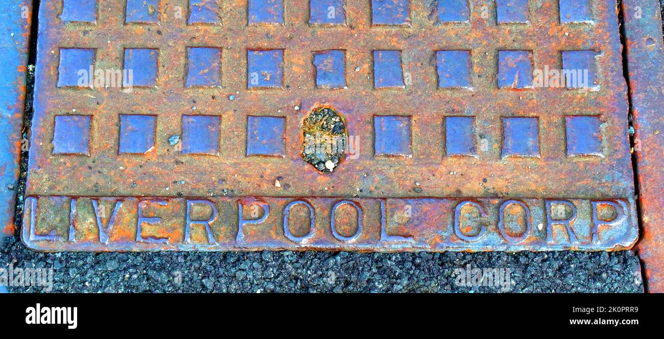 Liverpool Corp, cast iron grid,in the road, South Liverpool, Merseyside, England, UK Stock Photo