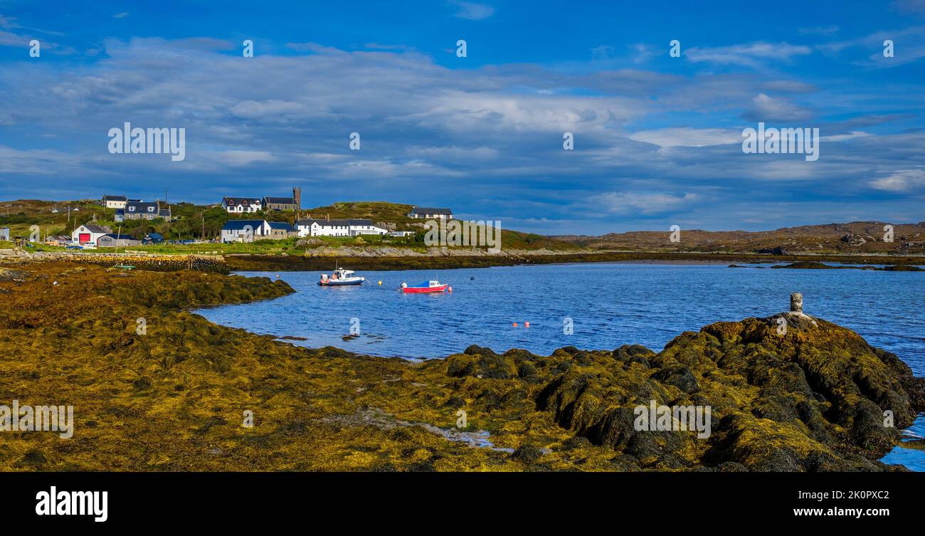 A view towards the main settlement on the Island of Coll, Scotland - the village of Arinagour. Stock Photo