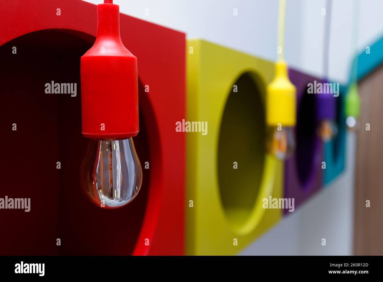 detail of unlit lamps in colored light fixtures - light and idea concept Stock Photo